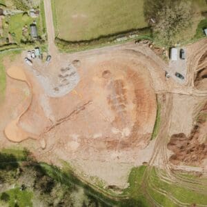 A birds eye view taken by a drone and looking at a new countryside building site. Communion Architects Hereford