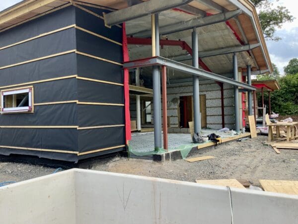 Close up of the soon-to- be-glazed west elevation of a stunning barn conversion with incredible views. Communion Architects Hereford